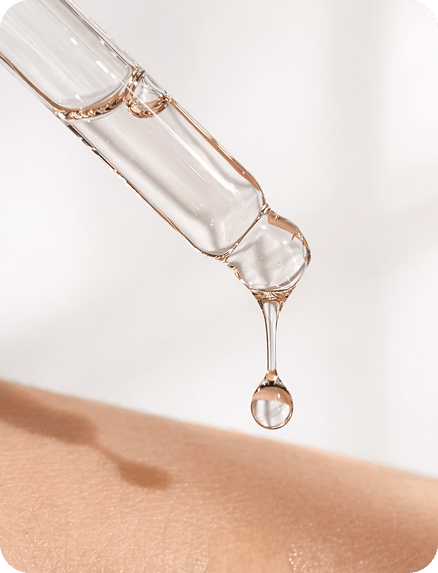 Serum drop applied to skin representing Lijin Clinic personalized skin treatment programs
